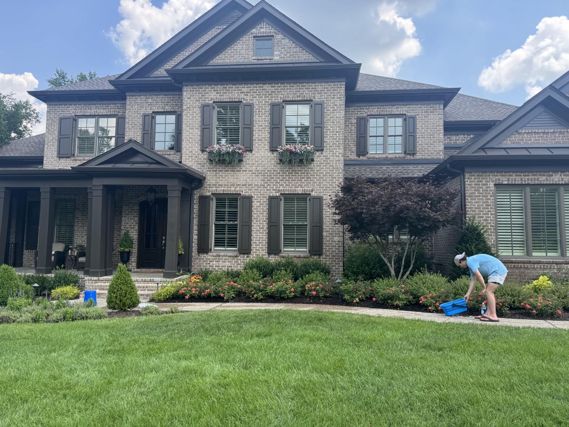 RBT crew detailing a brick estate front entrance